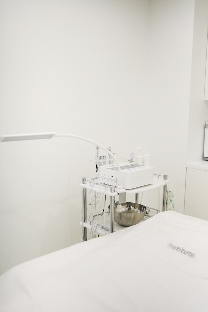 Minimalist beauty salon interior with high-end skincare equipment for treatments.